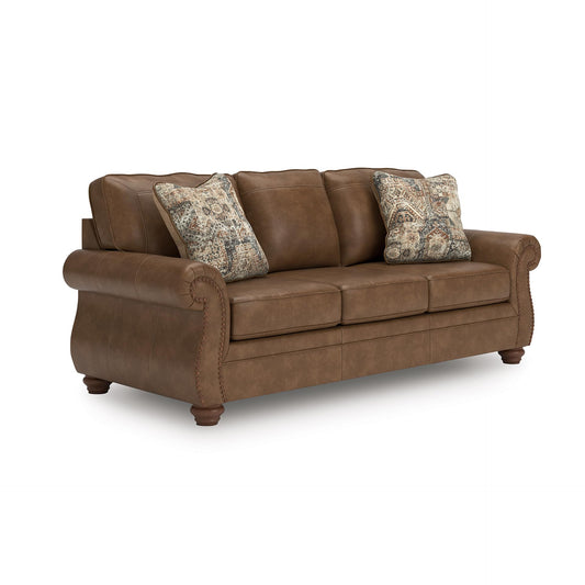 Signature Design by Ashley Shadsburne Rustic Faux Leather Sofa with Nailhead Trim and 2 Throw Pillows, Brown
