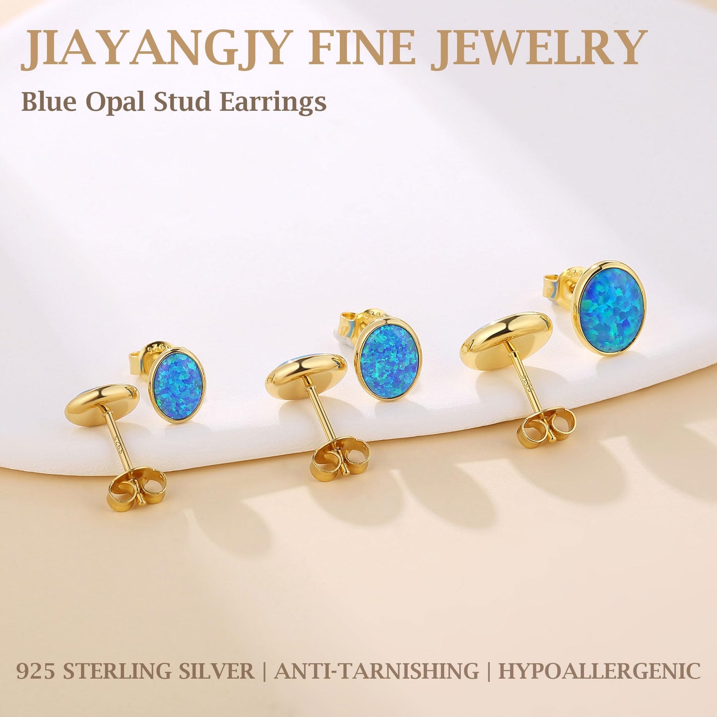 JiayangJY Silver Blue Fire Opal Stud Earrings for Women 18K Yellow Gold Plated Sterling Silver Oval Shape 7mm Opal Earrings with Push Back