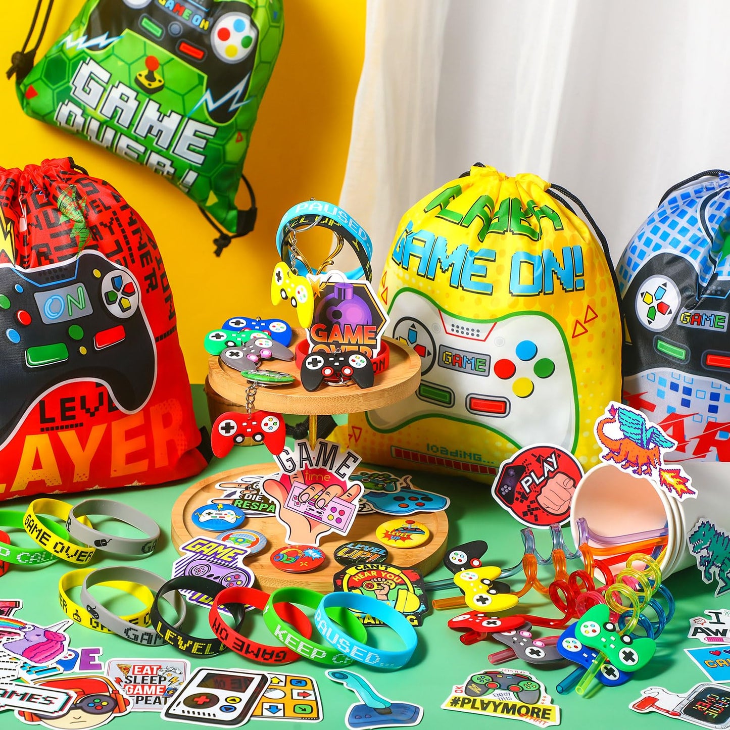 Sadnyy 140 Pcs Gaming Party Favors Video Game Birthday Decorations Supplies Drawstring Bags with Silicone Bracelets Keychains Straws Button Pins Stickers for Party Rewards Goodie Bags Stuffers