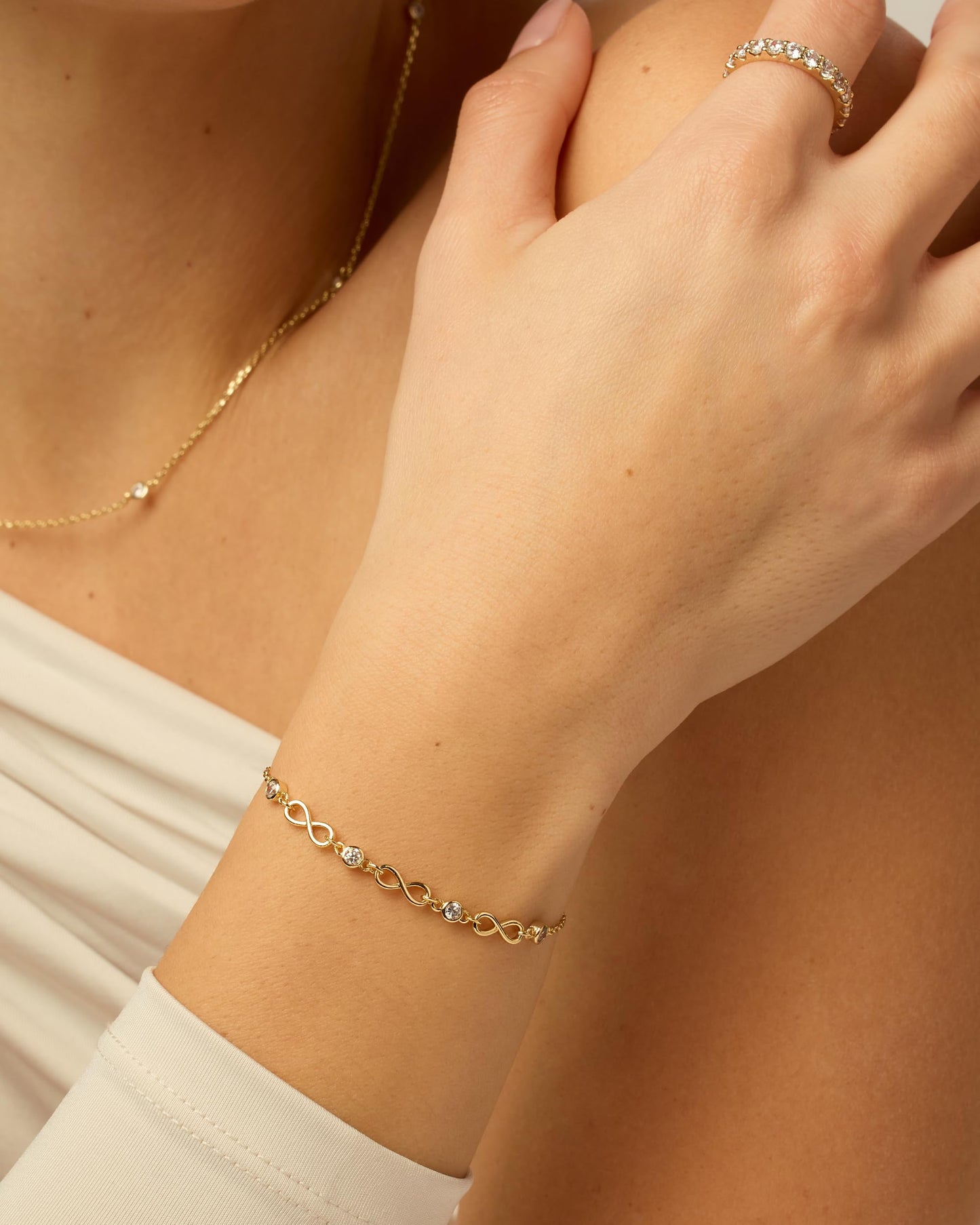 PAVOI 14K Yellow Gold Plated Infinity Simulated Diamond Station Chain Bracelet for Women | Cubic Zirconia Adjustable Friendship Bracelet