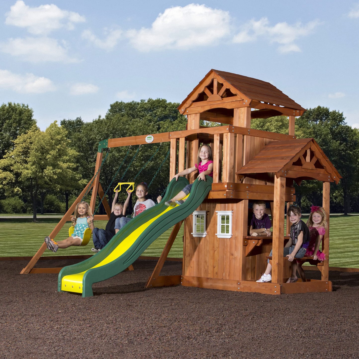 Backyard Discovery Tanglewood Cedar Wood Swing Set with Wave Slide, Clubhouse, Playhouse, Covered Snack Bar Window, Bench, Rock Wall Ladder, Belt Swings, Trapeze, Porch, Step Ladder, Outdoor Playset